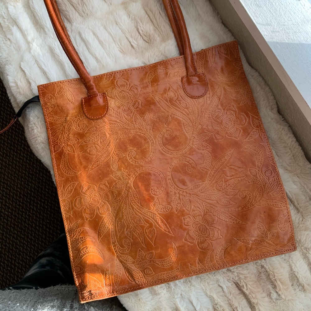 Leather tote with floral pattern